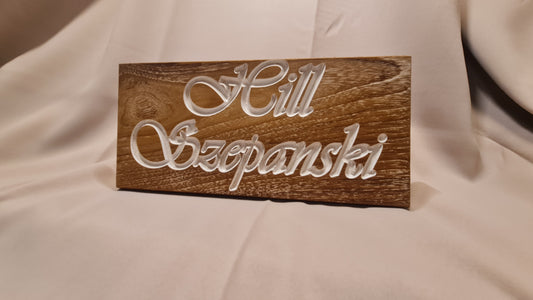 Namn skylt med gravyr och epoxy inlay